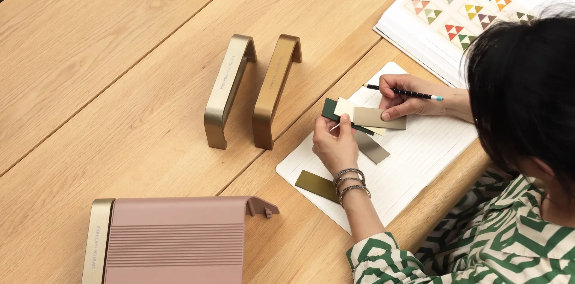 Designer working with colour swatches and charger materials